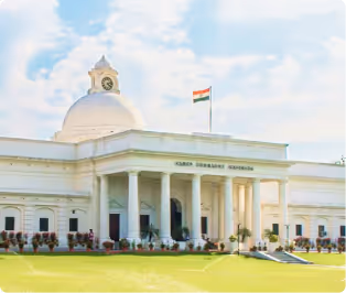 White government building with a dome and the Indian flag.
