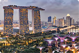 Marina Bay Sands and Supertree Grove lit up at dusk