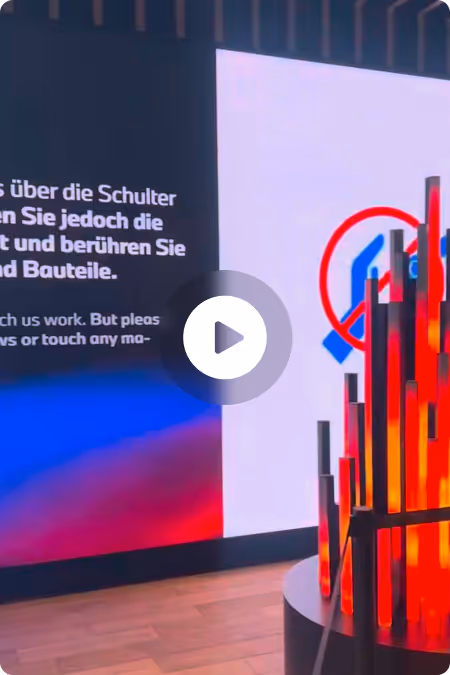 Video thumbnail: a modern exhibition space with glowing red light tubes