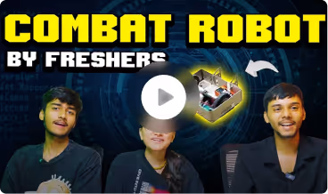Three NST first-year students with the combat robot they built.