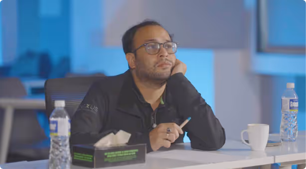 A student taking notes during a startup workshop.