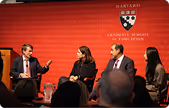 Panel discussion on stage at a Harvard Kennedy School event